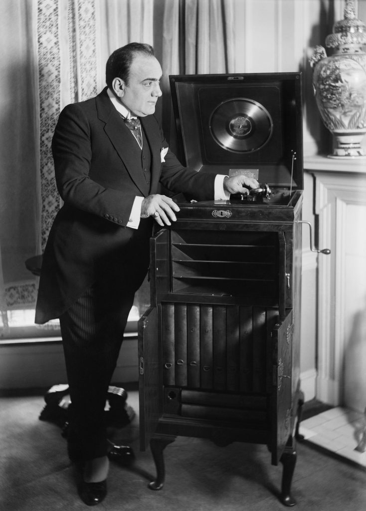 A high-class man at an old phonograph
