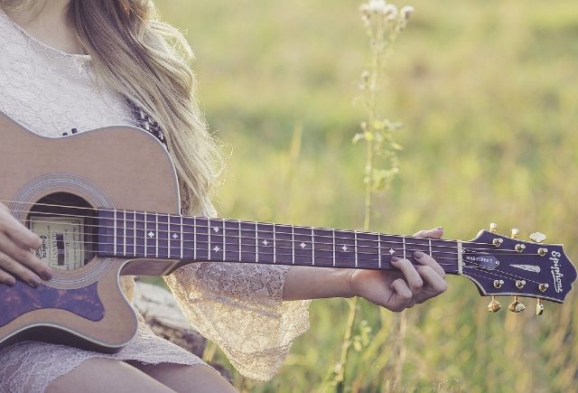 harmonizing the minor scale may not be so important for this woman with a guitar