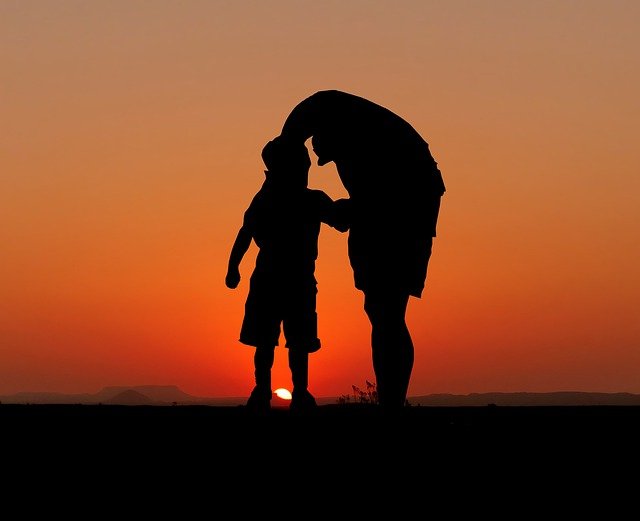 Dad and son silhouette to portray the concept of a major key and its relative minor.