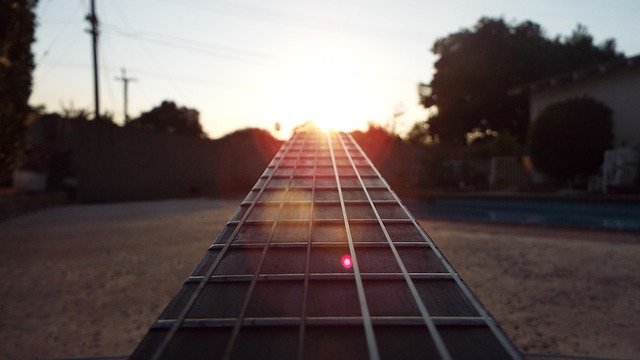 A guitar neck in sunrise